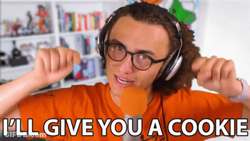 A Young Man Wearing Headphones And Glasses Says I 'Ll Give You A Cookie GIF