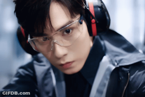 A Young Man Wearing Headphones And Safety Goggles GIF