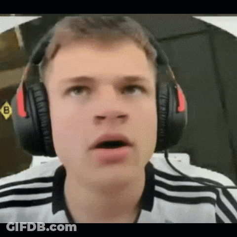 A Young Man Wearing Headphones Is Making A Surprised Face GIF