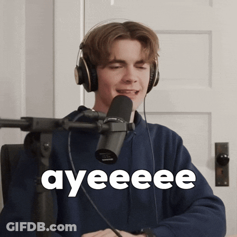A Young Man Wearing Headphones Is Singing Into A Microphone And The Word Ayeeee Is On The Screen Behind Him GIF