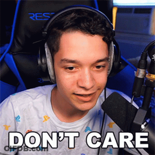 A Young Man Wearing Headphones Is Sitting In Front Of A Microphone And Says Do N't Care GIF