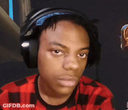 A Young Man Wearing Headphones Looks At The Camera GIF