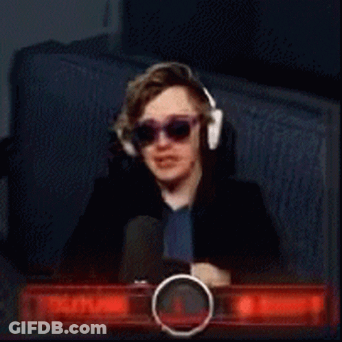 A Young Man Wearing Sunglasses And Headphones Is Sitting In Front Of A Youtube Sign GIF