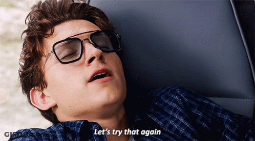 A Young Man Wearing Sunglasses Is Laying Down And Says Let 'S Try That Again GIF