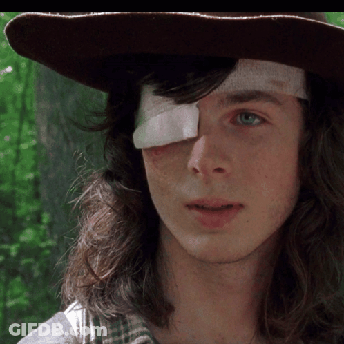 A Young Man With A Bandage On His Eye GIF