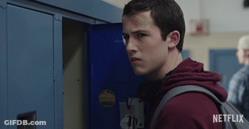 A Young Man With A Bandage On His Forehead Is Standing In Front Of A Locker That Says Netflix On It GIF