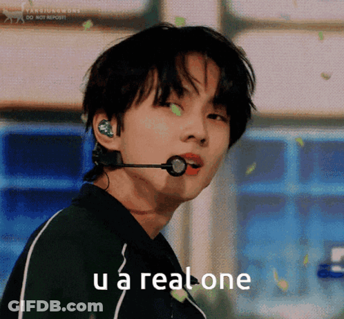 A Young Man With A Microphone In His Ear And The Words U A Real One Below Him GIF
