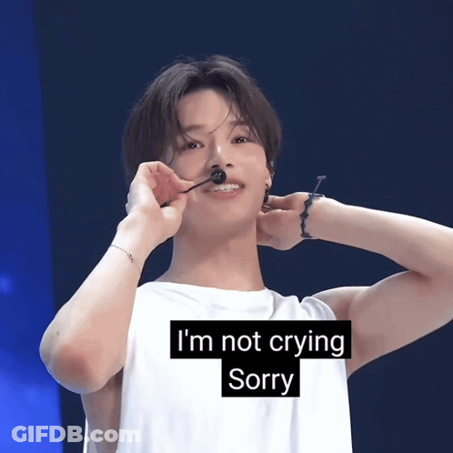 A Young Man With A Microphone In His Mouth And The Words I 'M Not Crying Sorry Below Him GIF