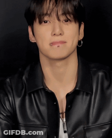A Young Man With A Piercing In His Lip Is Wearing A Black Jacket GIF