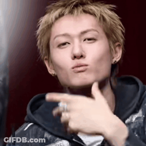 A Young Man With A Ring On His Finger Is Making A Funny Face GIF