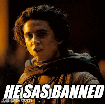 A Young Man With A Scarf Around His Neck And The Words He Sas Banned On The Bottom GIF
