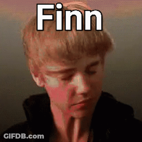 A Young Man With A Straw In His Mouth And The Name Finn Above His Head GIF