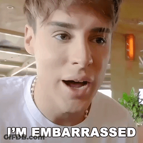 A Young Man With A Surprised Look On His Face And The Words I 'M Embarrassed Written Below Him GIF