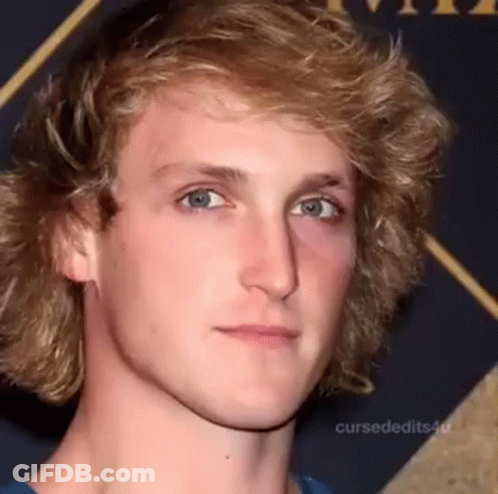 A Young Man With Blonde Hair And Blue Eyes Is Making A Funny Face . GIF