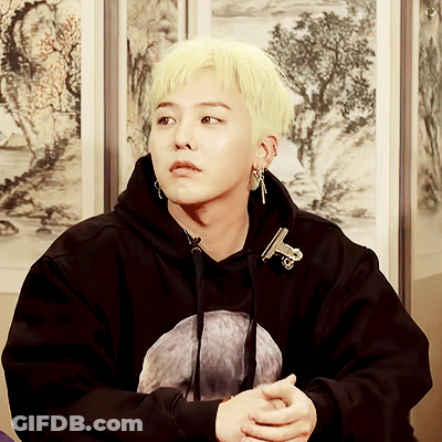 A Young Man With Blonde Hair Is Wearing A Black Sweatshirt GIF