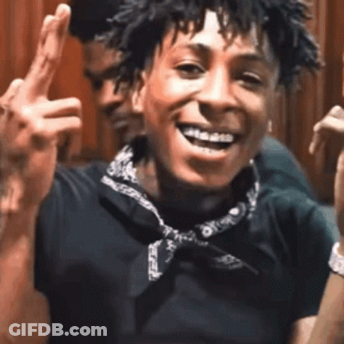 A Young Man With Braces On His Teeth Is Giving The Middle Finger . GIF