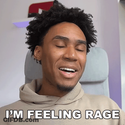 A Young Man With Curly Hair Is Smiling And Says I 'M Feeling Rage GIF
