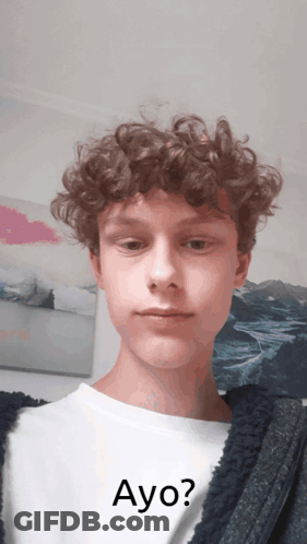Young Man With Curly Hair Wearing Ayo Shirt GIF