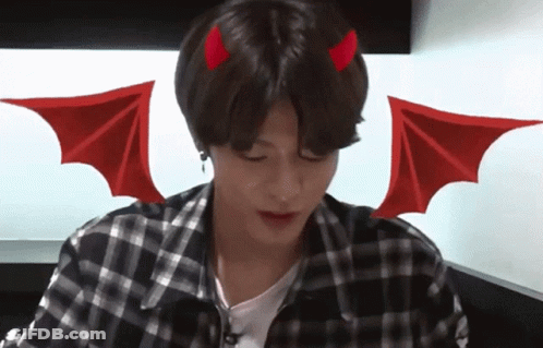 A Young Man With Devil Horns And Wings On His Head GIF