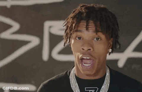 A Young Man With Dreadlocks Is Wearing A T-Shirt That Has The Letter T On It GIF