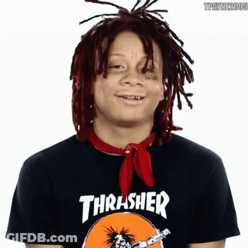A Young Man With Dreadlocks Is Wearing A Thrasher Shirt GIF