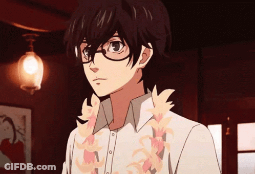 A Young Man With Glasses And A Lei Around His Neck Is Standing In A Dark Room . GIF
