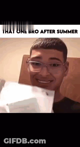 A Young Man With Glasses Is Smiling And Holding A Piece Of Paper . GIF