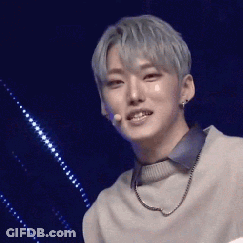 Young Man With Gray Hair Wearing Sweater And Necklace GIF