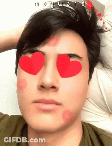 A Young Man With Hearts In His Eyes And The Name Mary Ward Written On His Forehead GIF