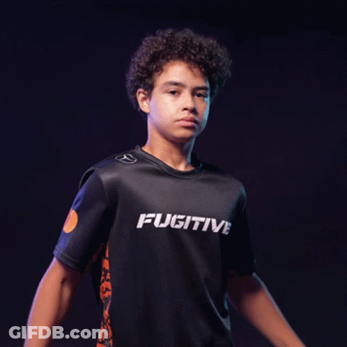 A Young Man With His Arms Crossed Is Wearing A Shirt That Says Ativ GIF