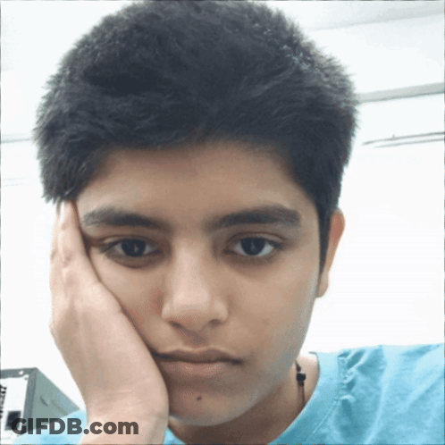 A Young Man With His Hand On His Face Is Wearing A Blue T-Shirt That Says ' At & T ' On It GIF