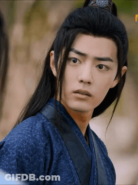 A Young Man With Long Black Hair Is Wearing A Blue Kimono GIF