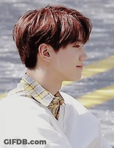 A Young Man With Red Hair And A Plaid Shirt GIF
