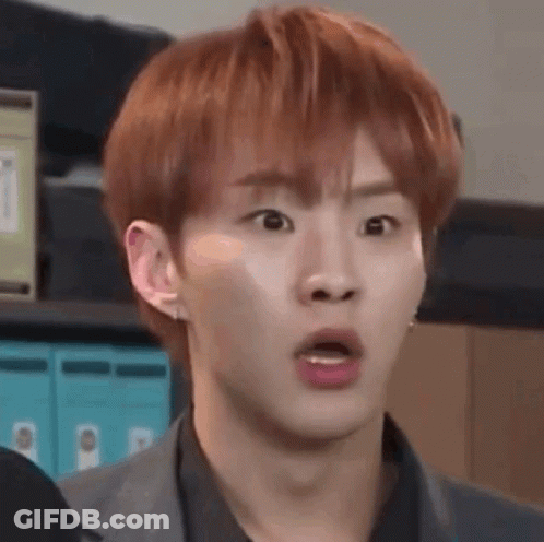 A Young Man With Red Hair Is Making A Funny Face . GIF