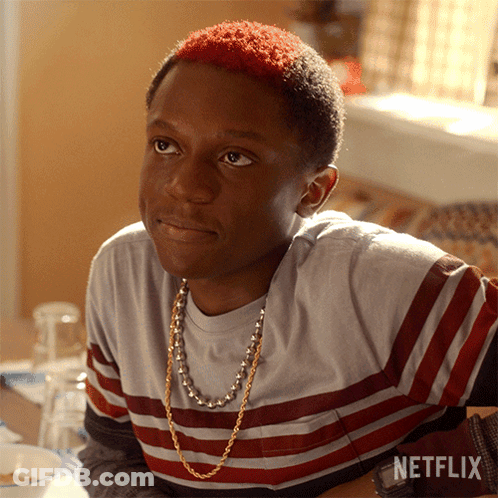 A Young Man With Red Hair Is Sitting At A Table With A Netflix Logo On The Bottom GIF