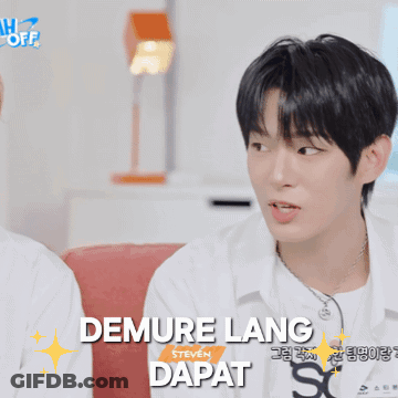 A Young Man With The Name Demure Lang Written On His Shirt GIF