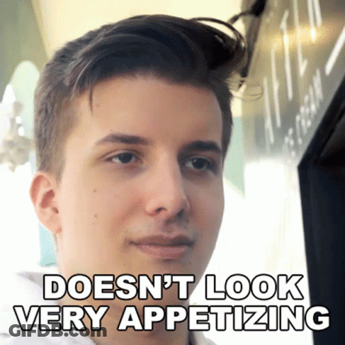 A Young Man With The Words Does N't Look Very Appetizing Above His Face GIF