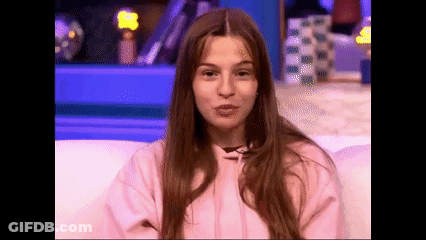 Woman Making Funny Face In Pink Hoodie GIF