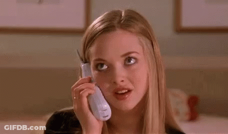 A Young Woman Is Talking On A Cell Phone And Making A Funny Face . GIF