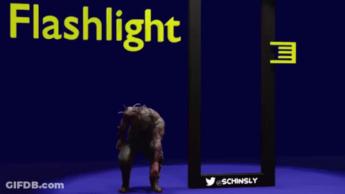 A Zombie Is Standing In Front Of A Flashlight GIF