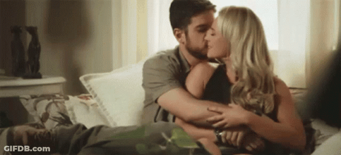 Abrazo Couple On A Couch GIF