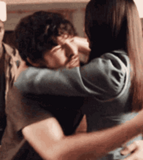 Abrazos Couple Hugging Comfortably GIF