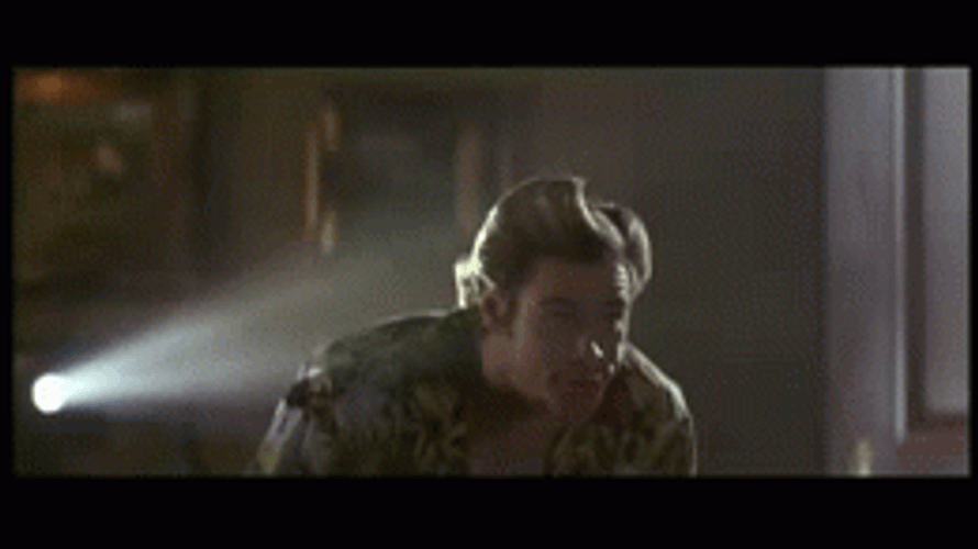 Ace Ventura Sitting Watching Movie GIF