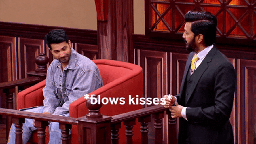 Actor Blows Flying Kiss GIF