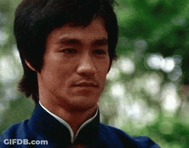 Actor Bruce Lee Bow With Hand Sign GIF