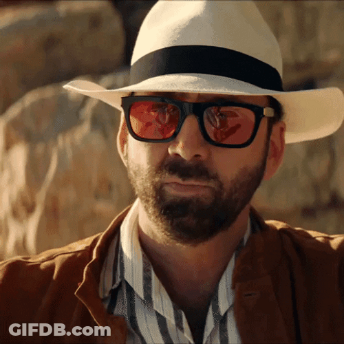 Actor Nicolas Cage Bow With Hand Sign GIF