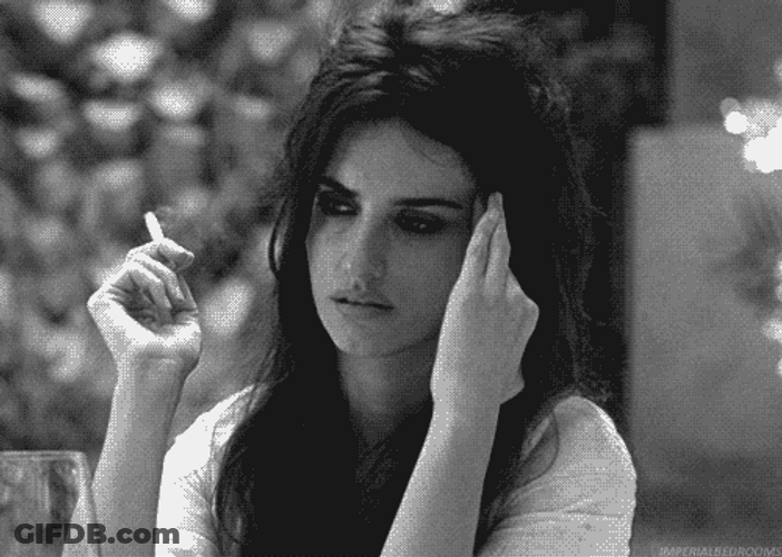 Actress Penélope Cruz Having Headache While Smoking GIF