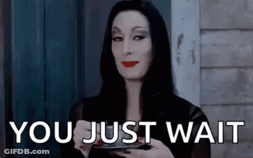 Addams Family Holding Coffee Saying You Just Wait GIF