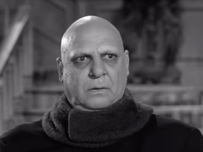 Addams Family Uncle Fester Fake Smile GIF