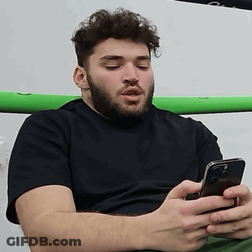 Adin Ross Checks Typing On Phone GIF